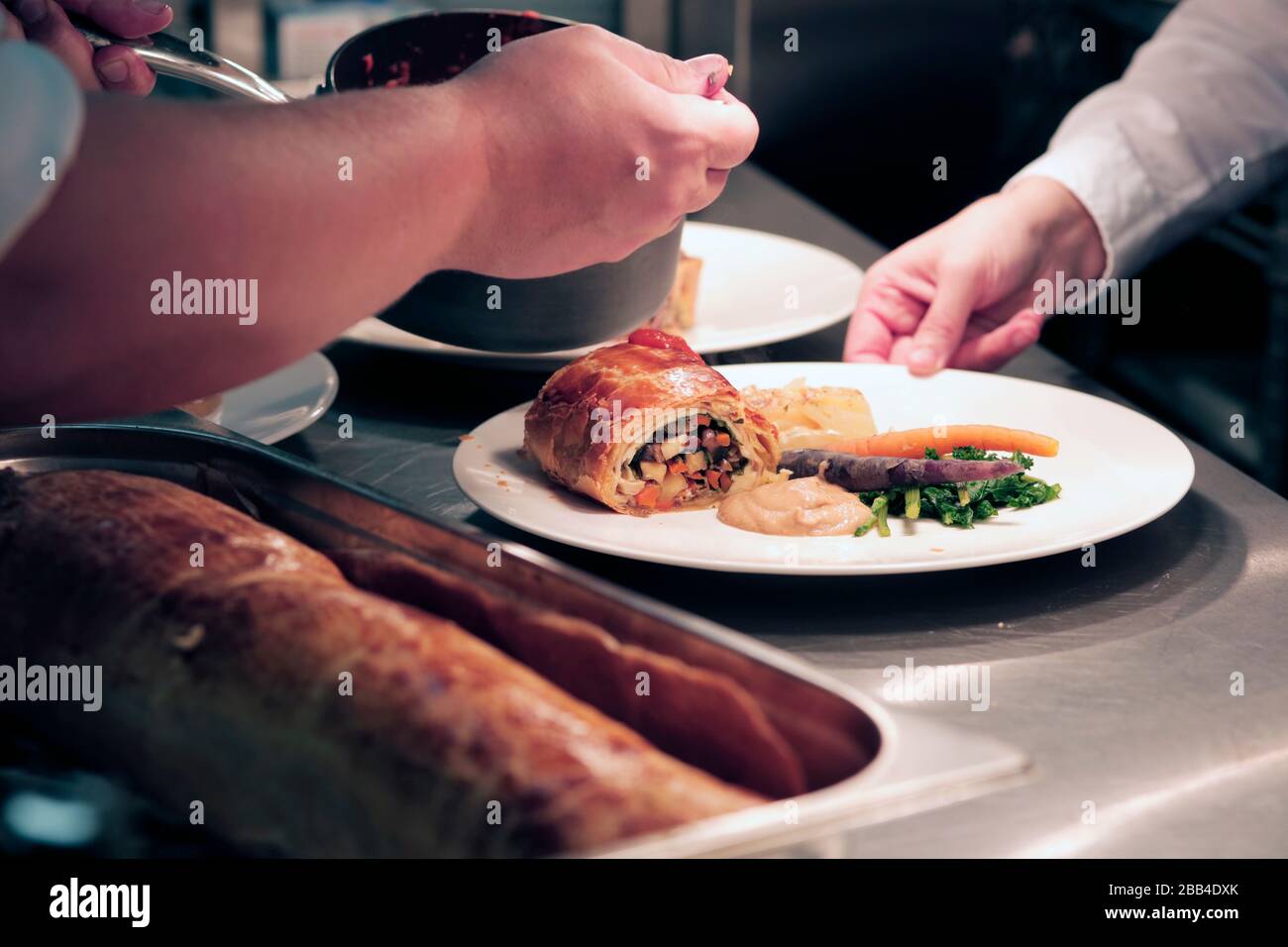 Chefs and kitchen staff at work in the kitchen at The Station Cafe Bar in Richmond, North Yorkshire, UK. 21/9/2018. Photograph: Stuart Boulton Stock Photo