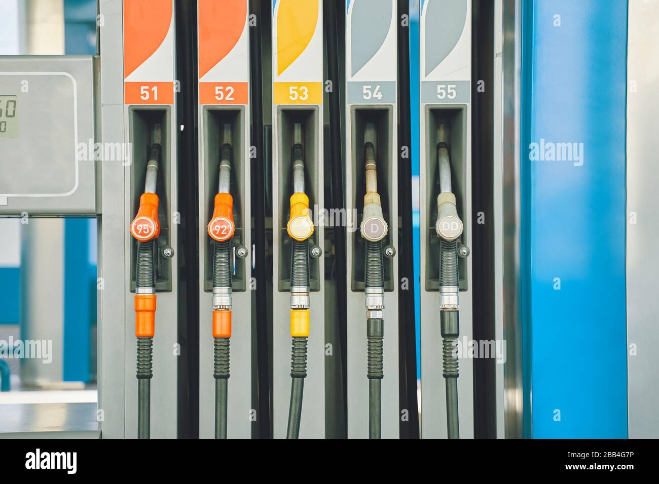 Gas station. Gas pump nozzles on the petrol station Stock Photo Alamy