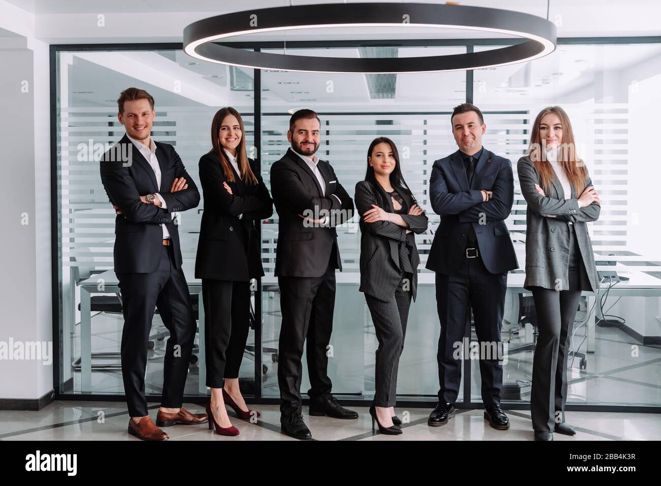 Confident team. Successful colleagues posing at camera Stock Photo