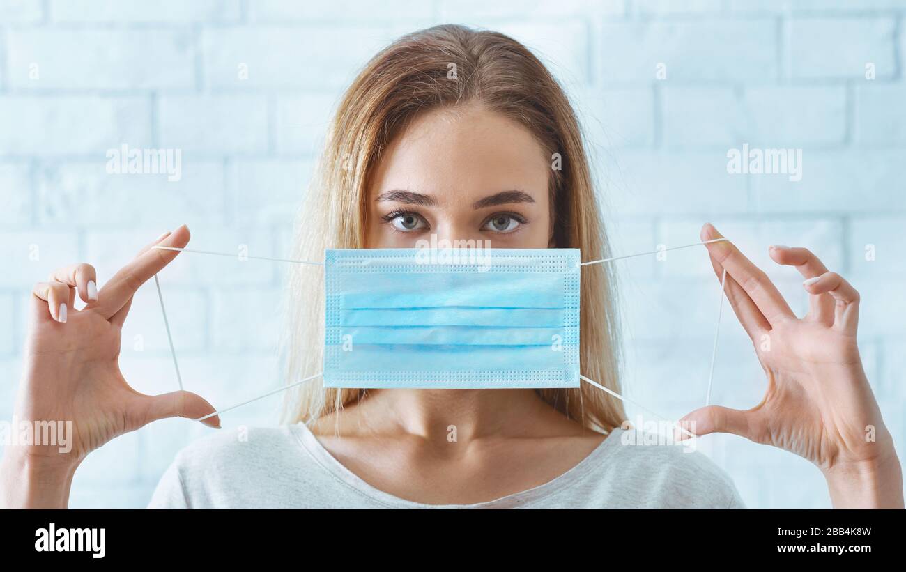 Sick girl puts on mask hi-res stock photography and images - Alamy