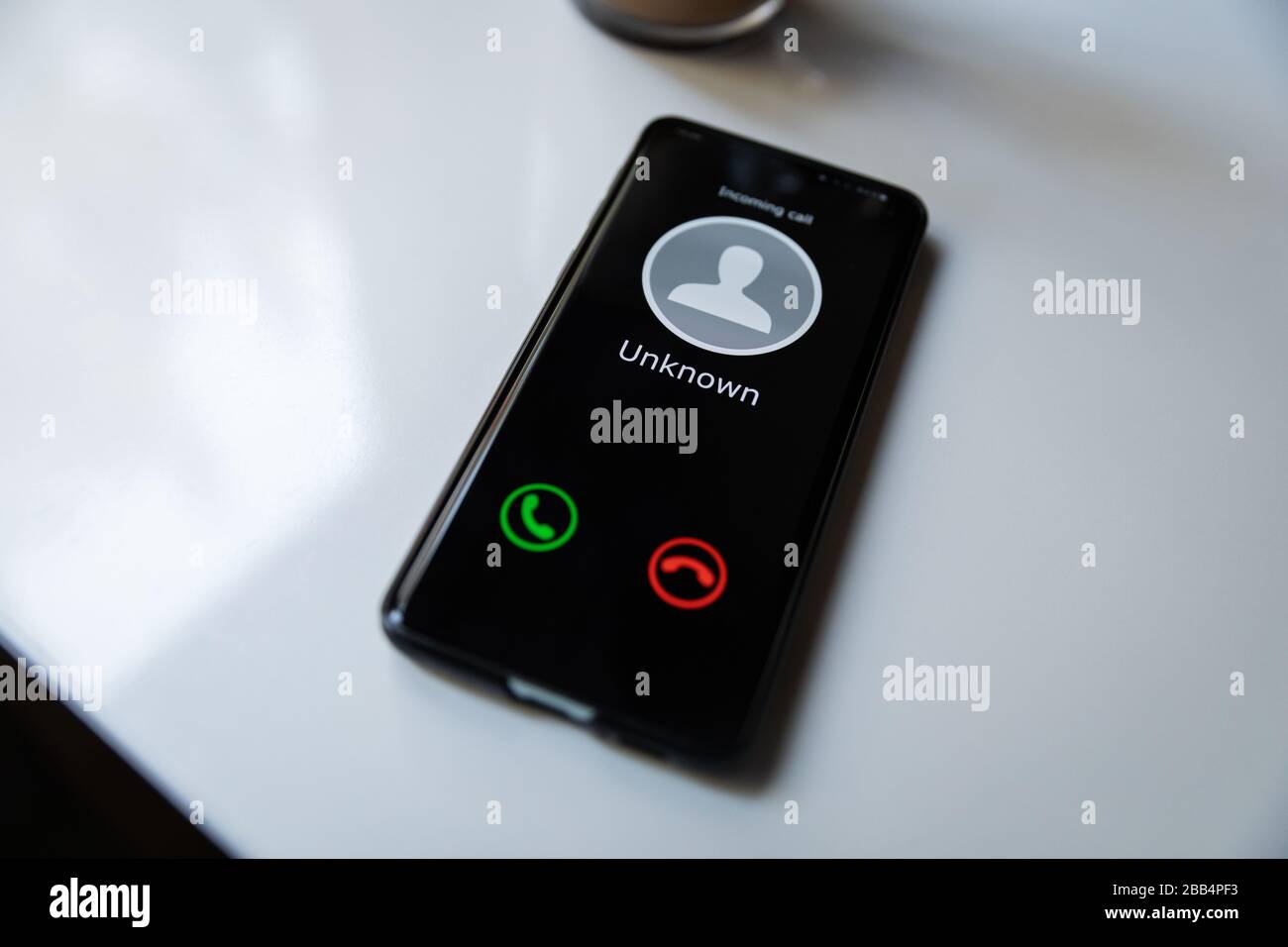 smart phone with incoming call from unknown caller. concept of scam spam and shadow calls Stock Photo