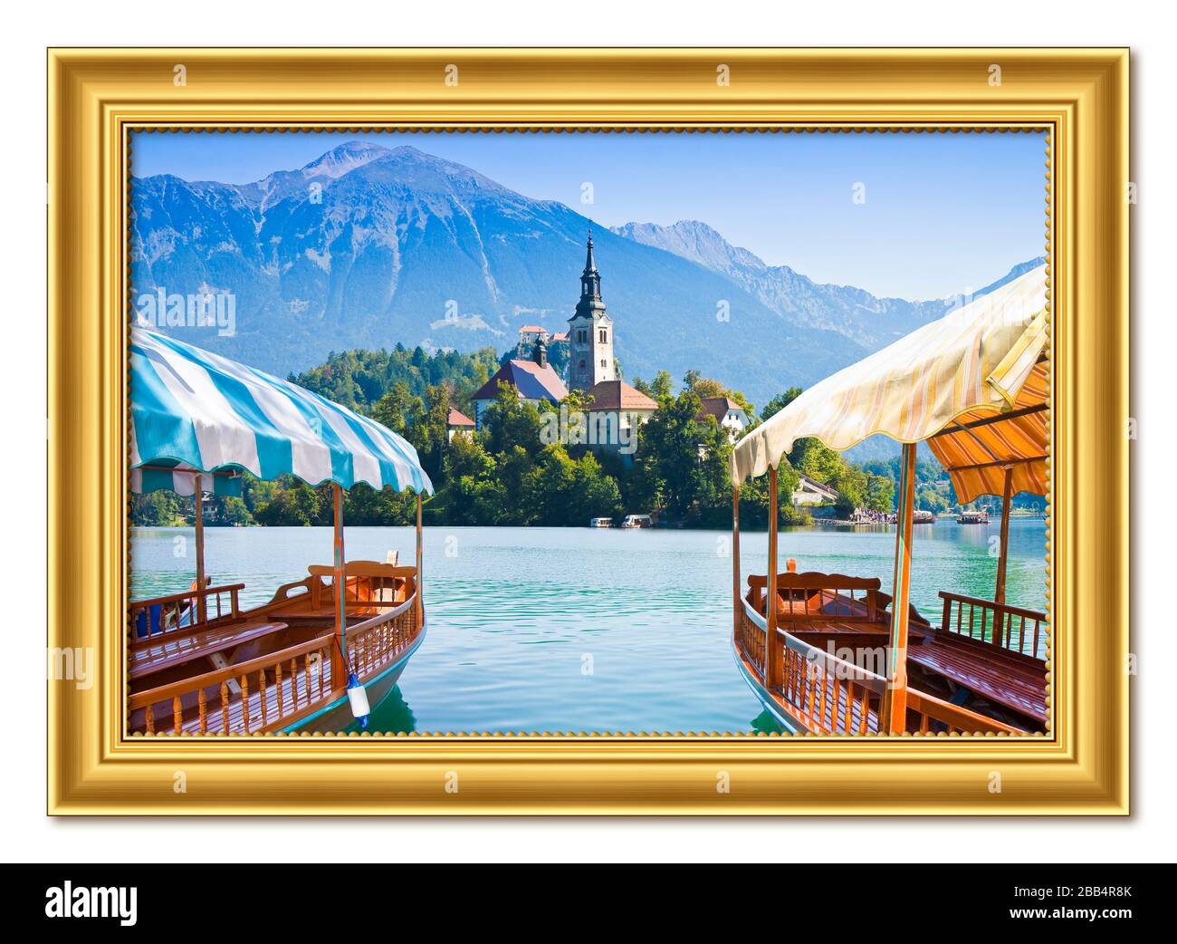 Typical wooden boats, in slovenian call 'Pletna', in the Lake Bled, the most famous lake in Slovenia with the island of the church (Europe - Slovenia) Stock Photo