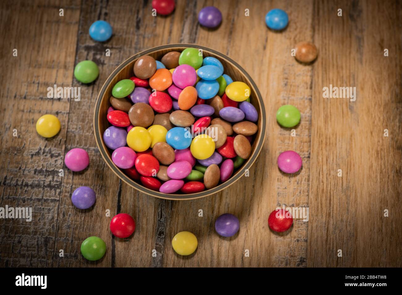 Multicolor candies on wooden hi-res stock photography and images - Alamy