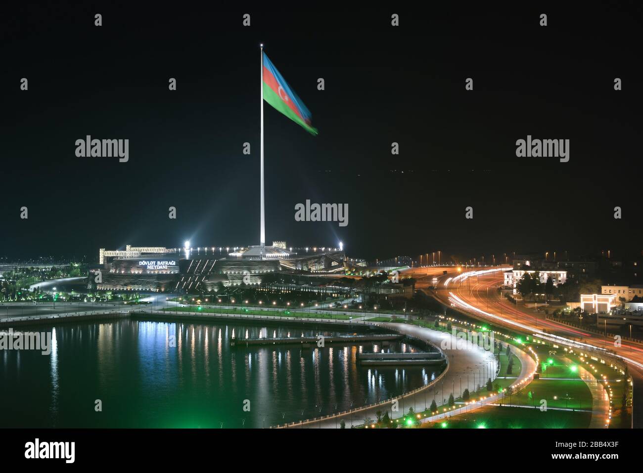 Night time view of the National Flag Square Baku, Azerbaijan built in the margins of the Caspian Sea. Neftchilar Avenue with night illumination. Stock Photo