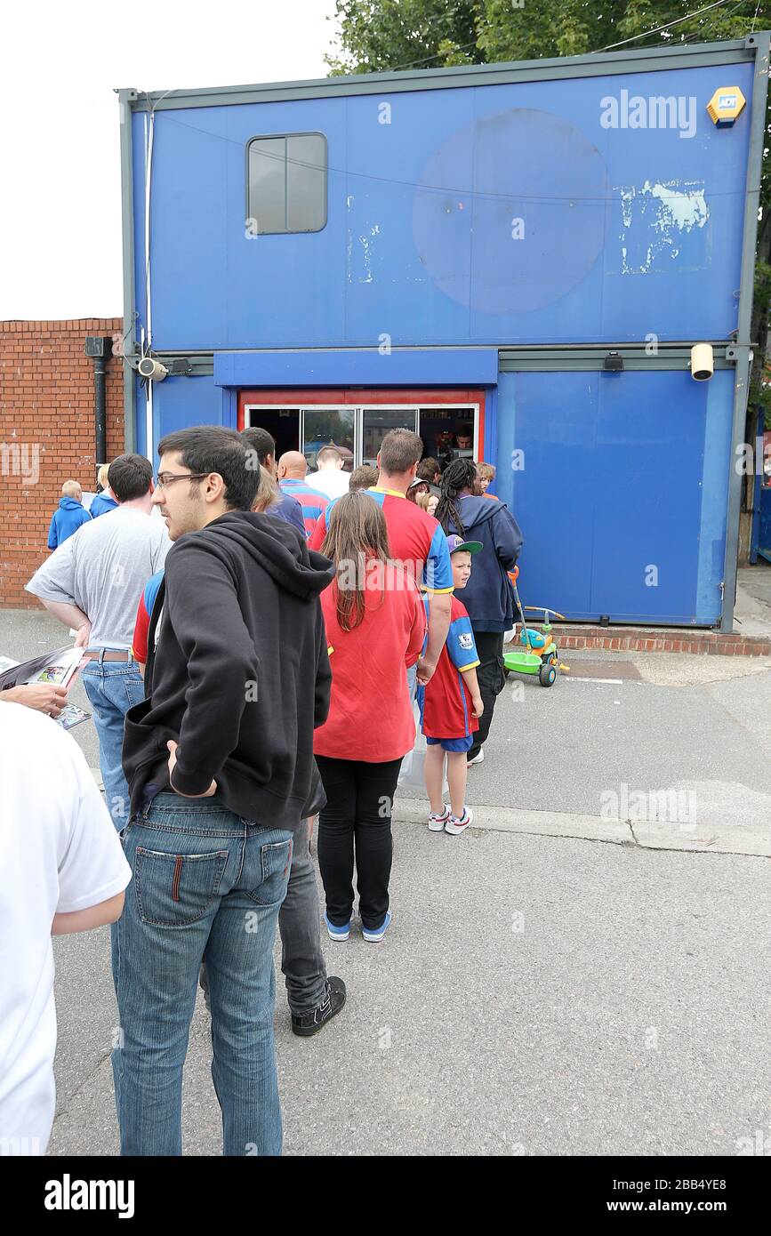 Fans queue at the ticket office outside Selhurst Park before the match ...