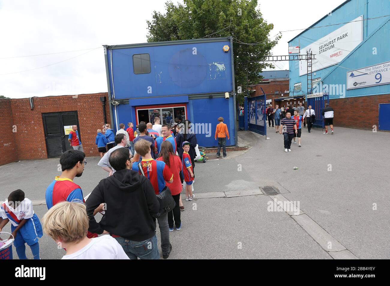 Fans queue at the ticket office outside Selhurst Park before the match ...