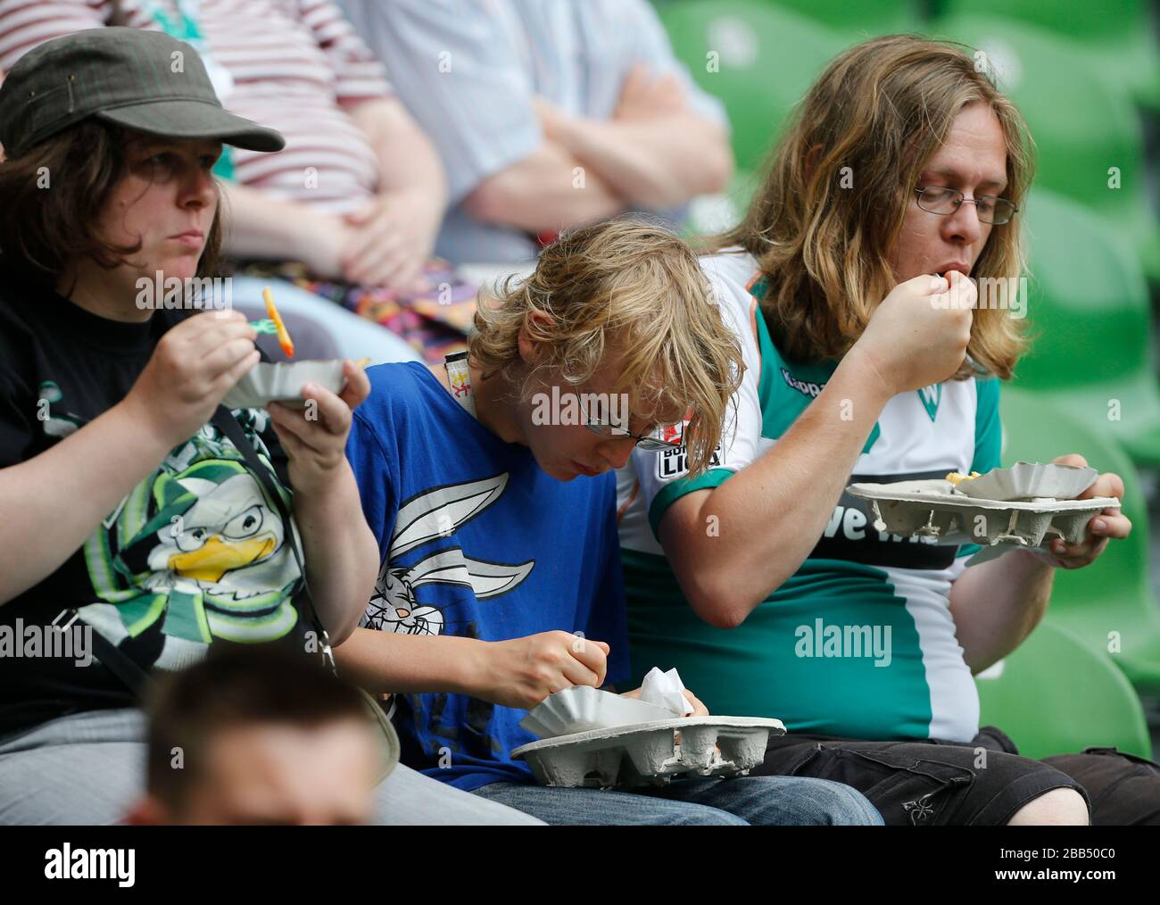 Football fans in the stands enjoy a meal before kick-off Stock Photo ...