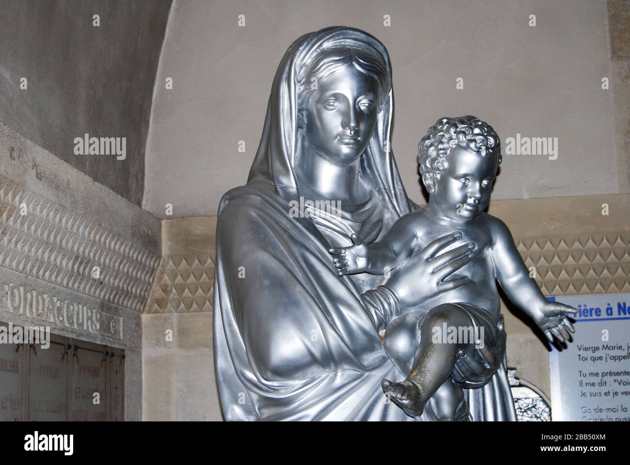 Statue of the Virgin Mary / Vierge Marie with baby Jesus, in the crypt, near the burner in the Basilique Notre-Dame de la Garde, la Bonne Mère Stock Photo