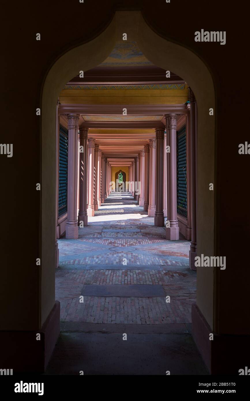 A view down a restored arched corridor with pillars of the Schwetzingen Mosque at the Schwetzingen Palace, Germany. Stock Photo