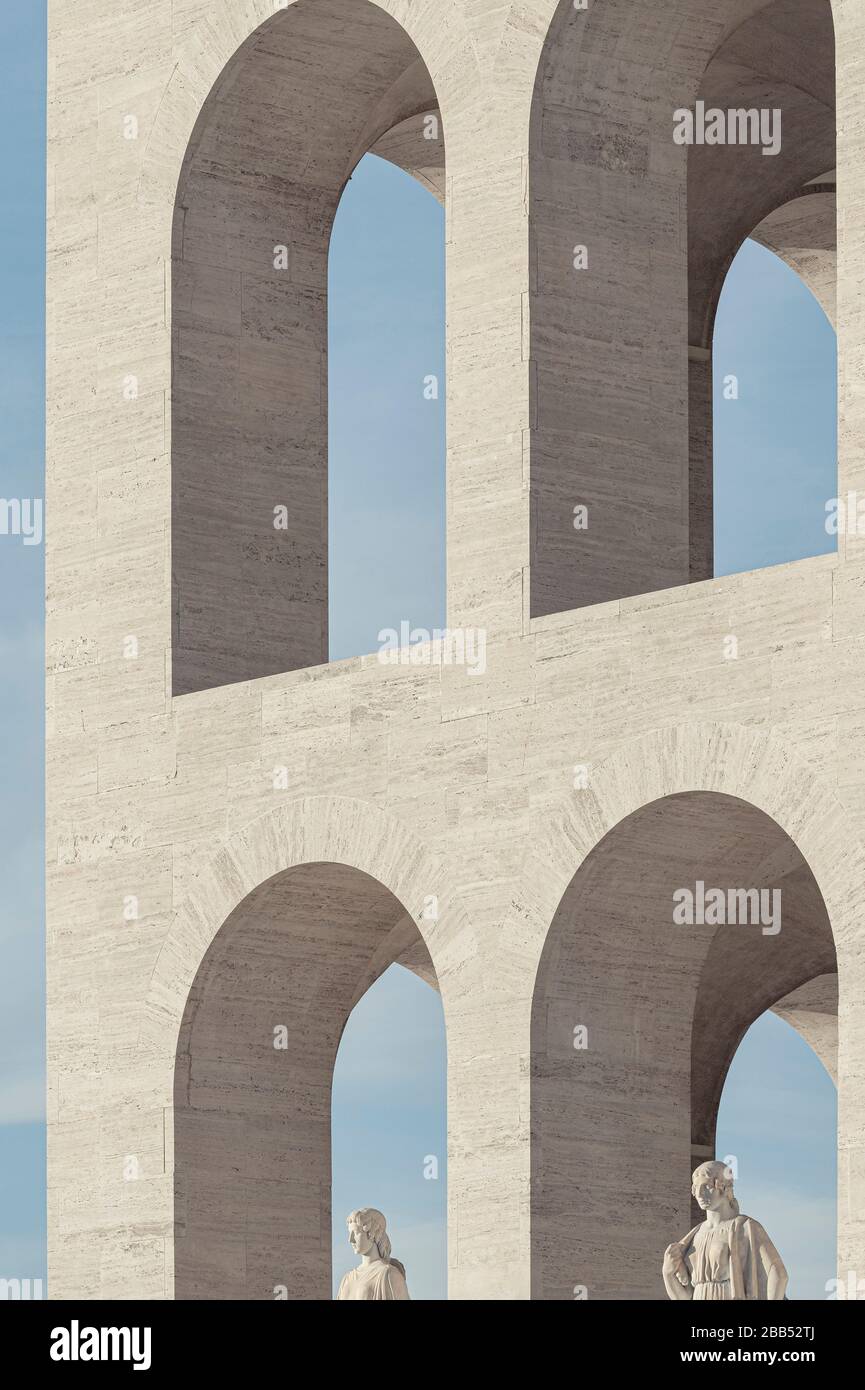 Detail of the facade with the marble arches and the statues at the ground floor. Palazzo della Civiltà Italiana, Rome, Italy. Architect: Giovanni Guer Stock Photo