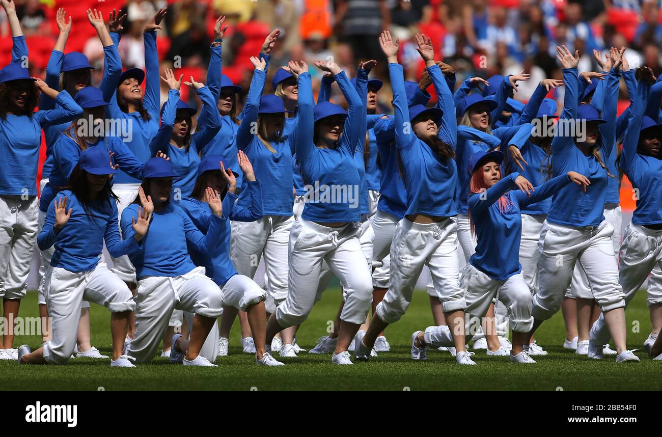 Dancers on the pitch before kick off Stock Photo Alamy