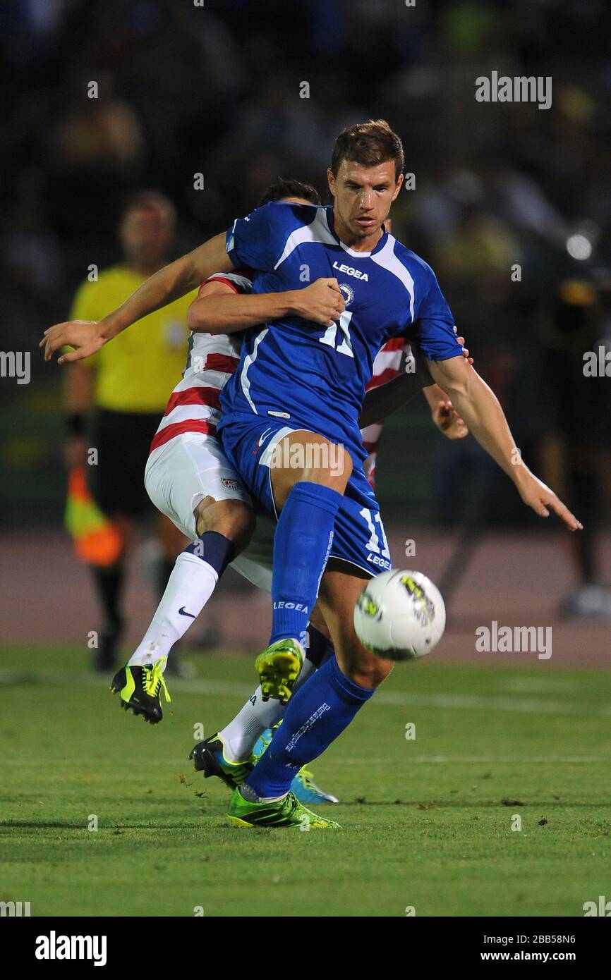 Bosnia-Herzegovina's Edin Dzeko and USA's Alejandro Bedoya battle for the ball Stock Photo