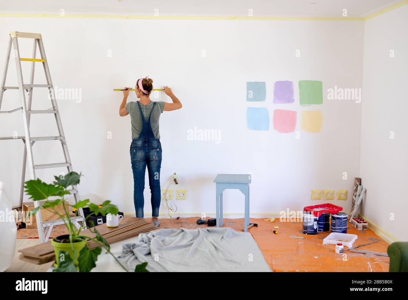 Women in Social Distancing doing DIY at home Stock Photo