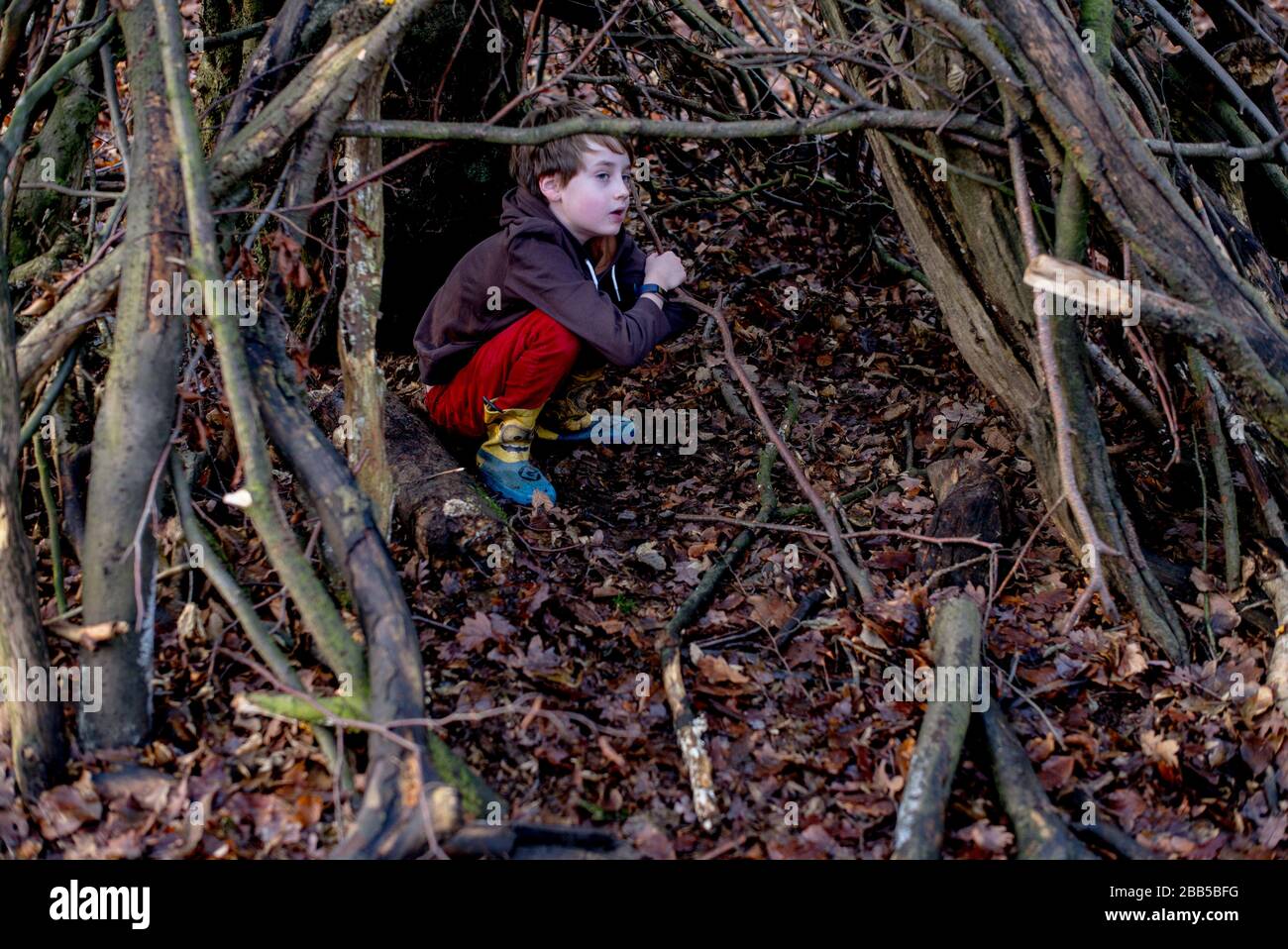 25/12/2019.  ©Licensed to Parsons Media Ltd. London, United Kingdom.Isaac 7 playing in a den in Epping Forest on Christmas Day morning 2019 Picture by Andrew Parsons / Parsons Media Stock Photo