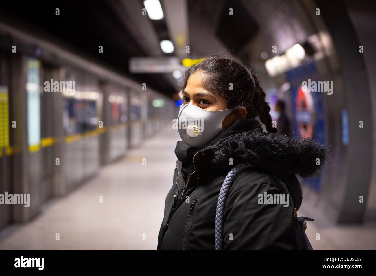 Commuters wearing face masks on the London Underground travelling