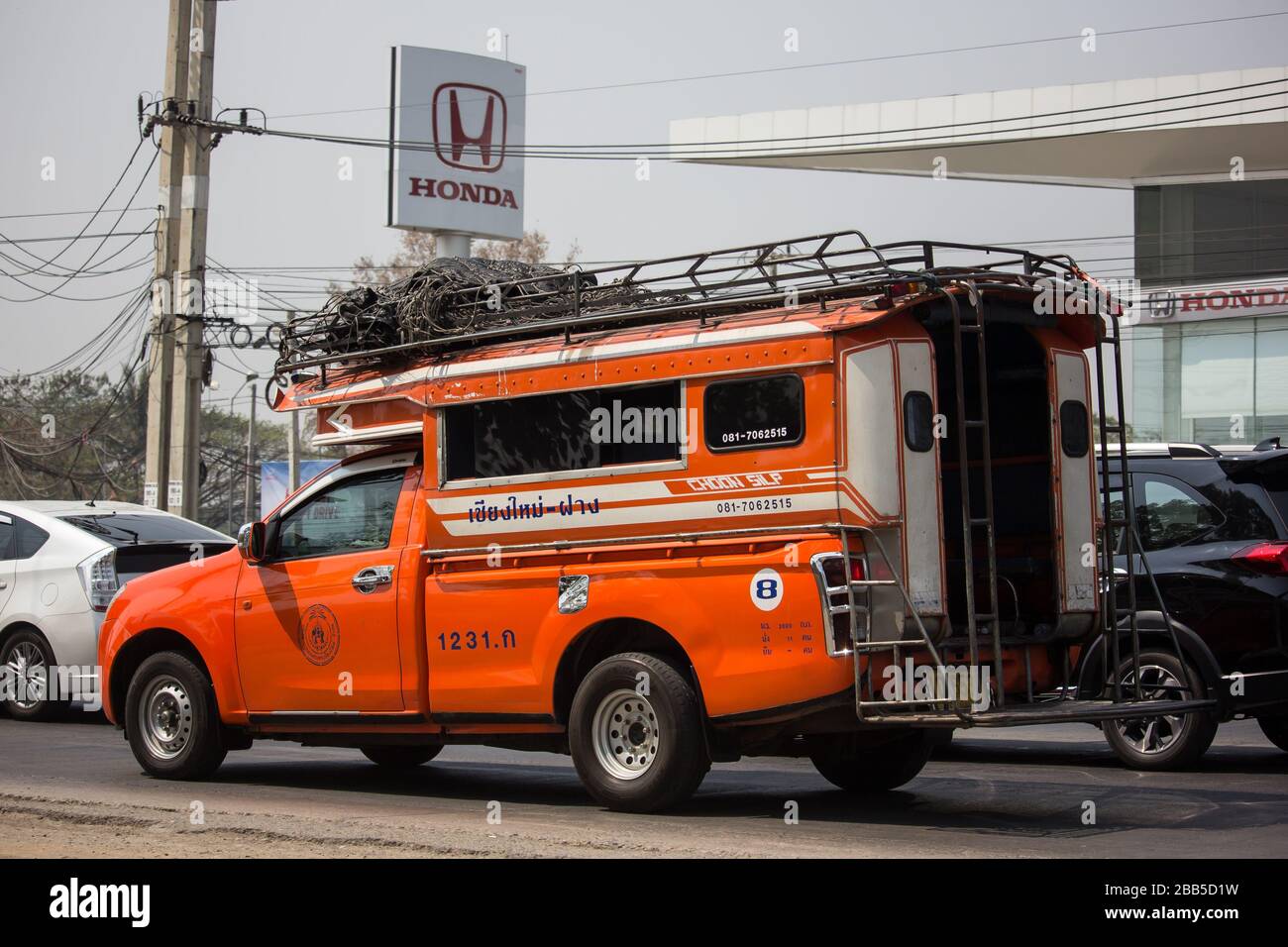 Chiangmai, Thailand - March  4 2020: Orange Pickup truck taxi Chiangmai to Fang.  On road no.1001, 8 km from Chiangmai Business Area. Stock Photo