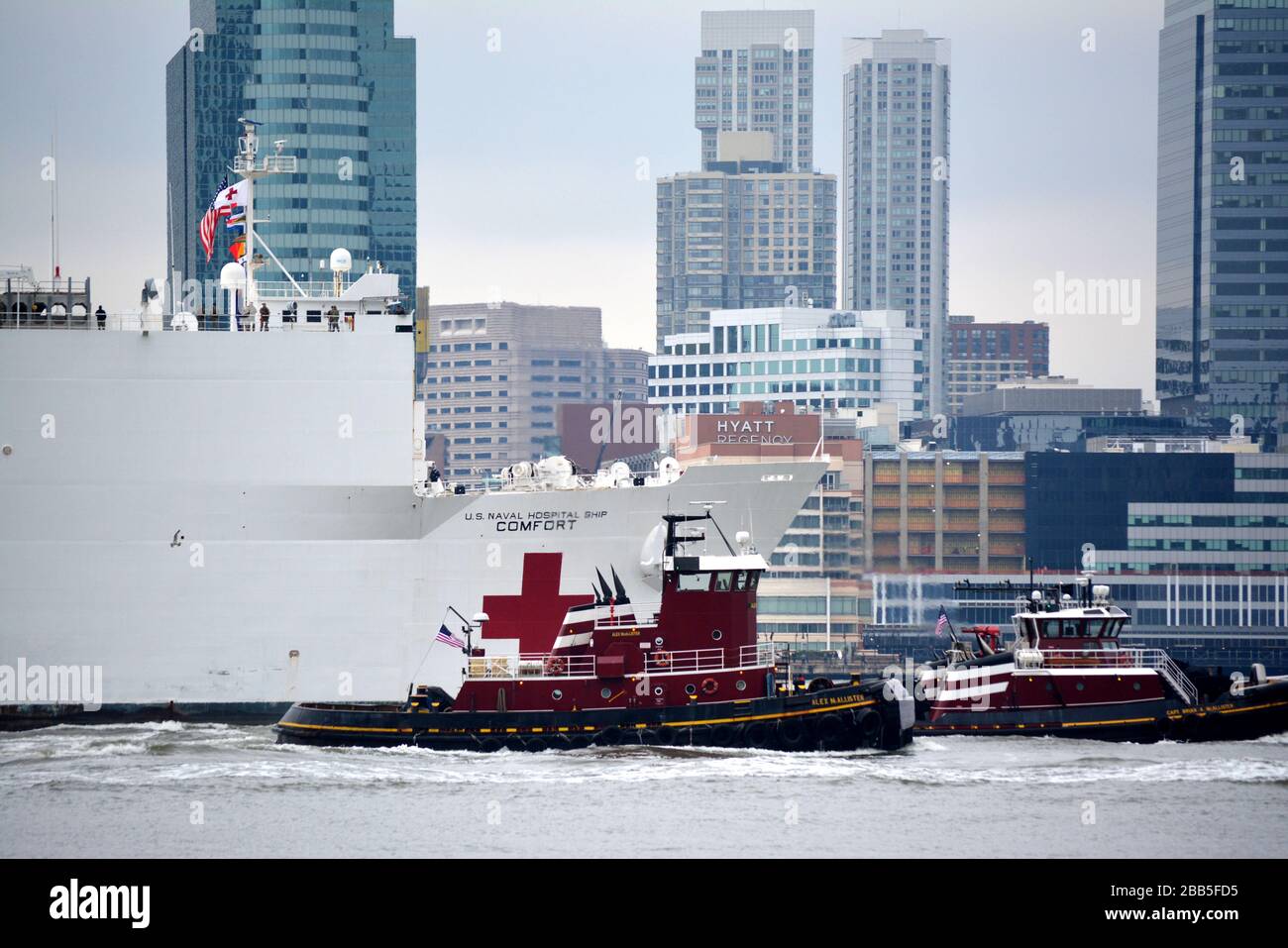 The USNS Comfort arrives in Manhattan to help hospitals handle patients during the coronavirus outbreak in the United States. Stock Photo