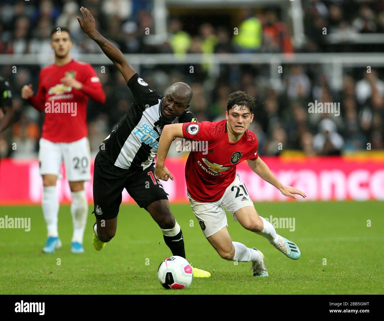 Newcastle United's Jetro Willems (left) and Manchester United's Daniel James battle for the ball Stock Photo