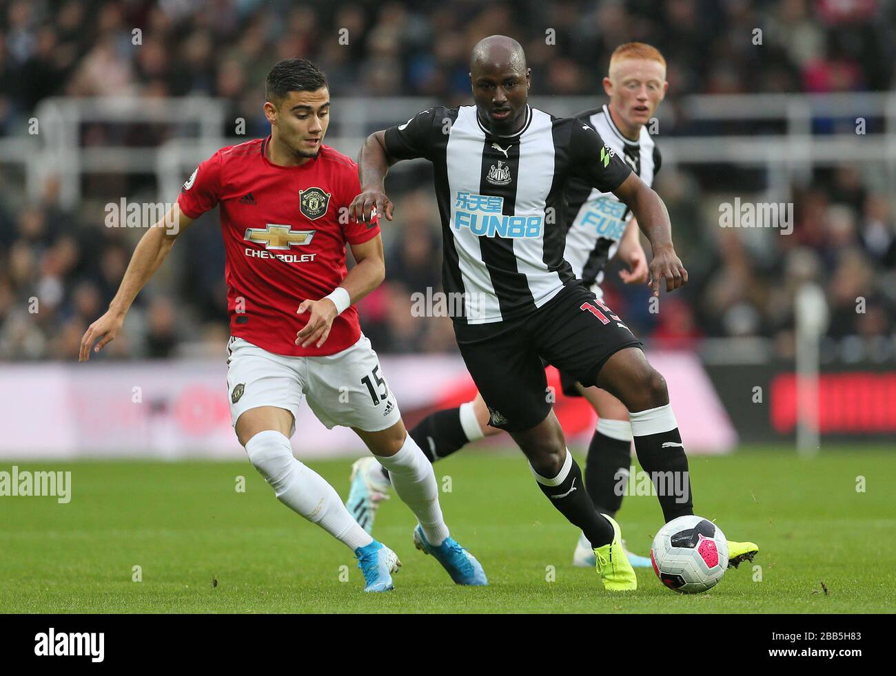 Manchester United's Andreas Pereira (left) and Newcastle United's Jetro Willems battle for the ball Stock Photo