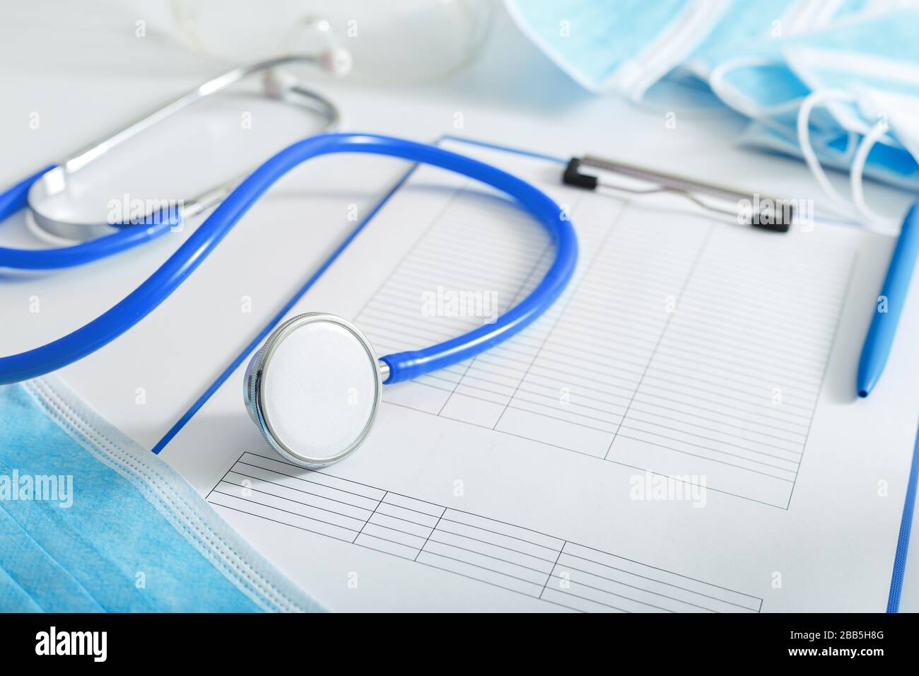 Doctor appointment. Blue stethoscope, medical test forms documents on