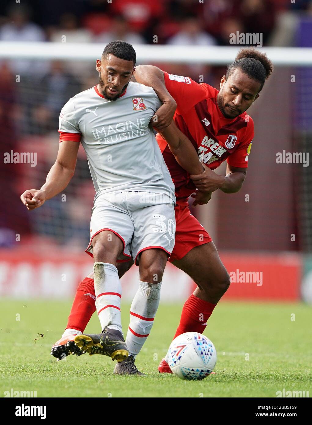 Swindon Town's Keshi Anderson (left) on the ball Stock Photo