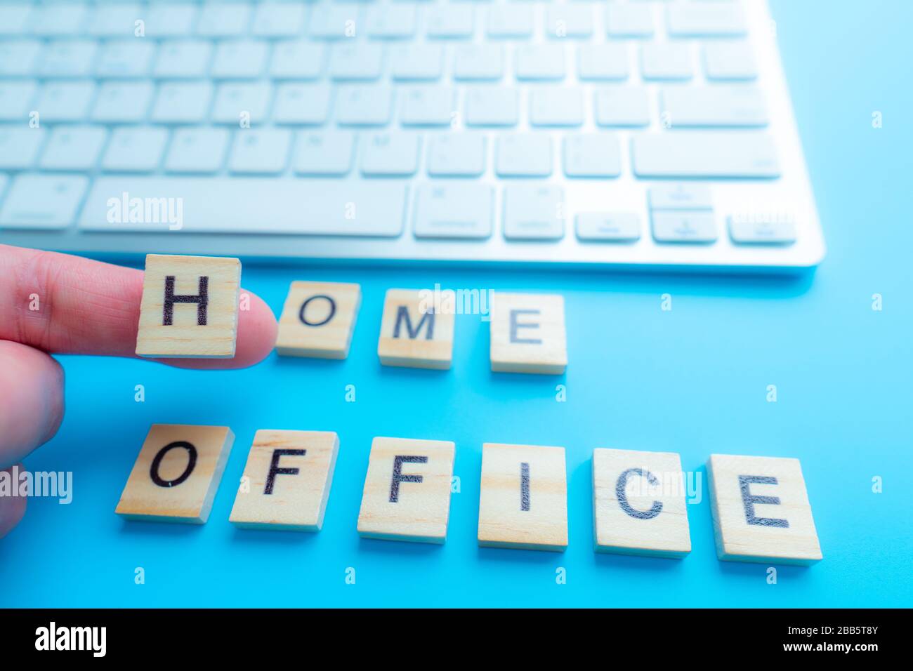 home office work from home concept with letters wooden. And keyboard