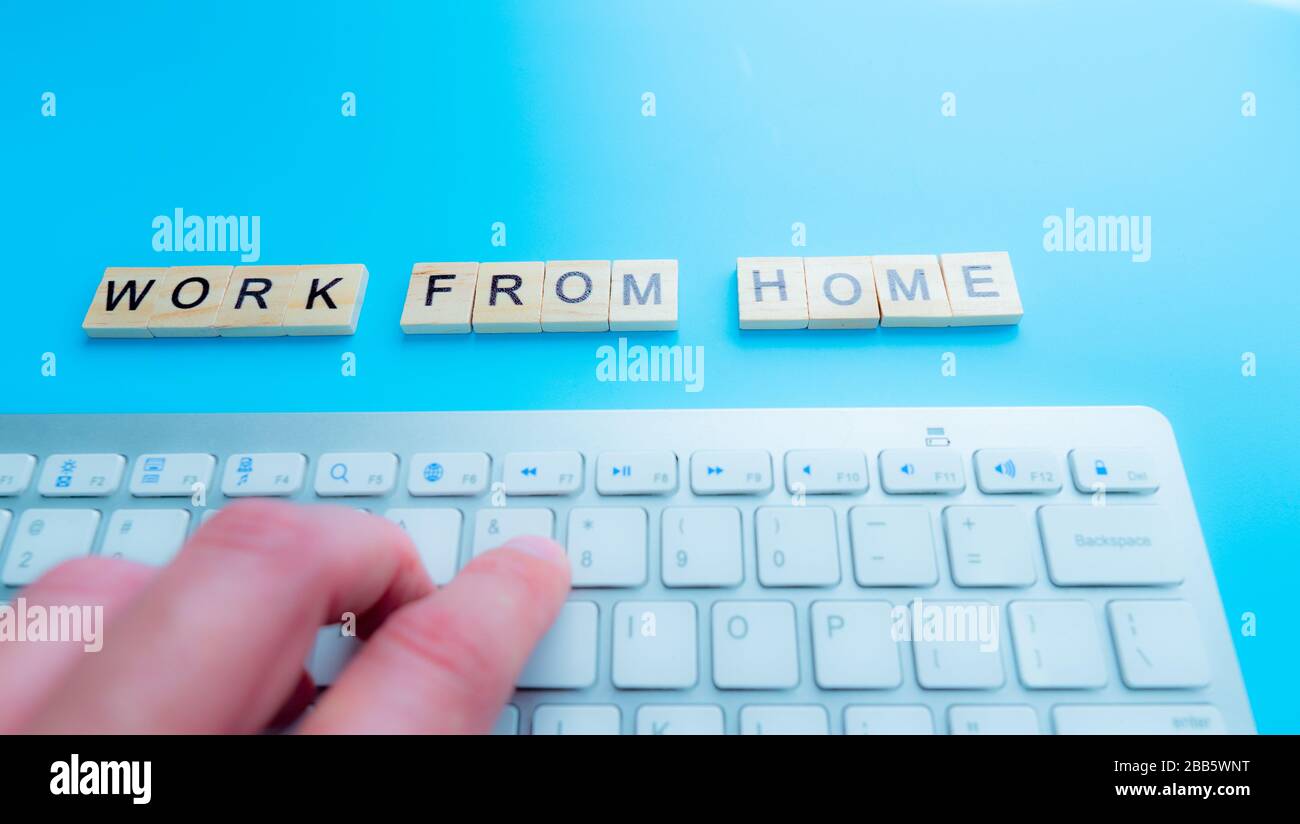 Work From Home, message concept written post it on laptop keyboard. Stock Photo