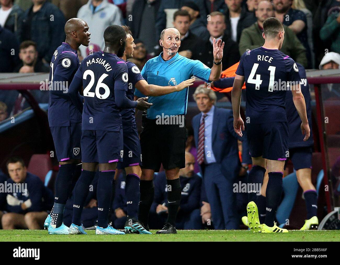 West Ham United's Arthur Masuaku (26) appeals to referee Mike Dean after being shown a red card Stock Photo