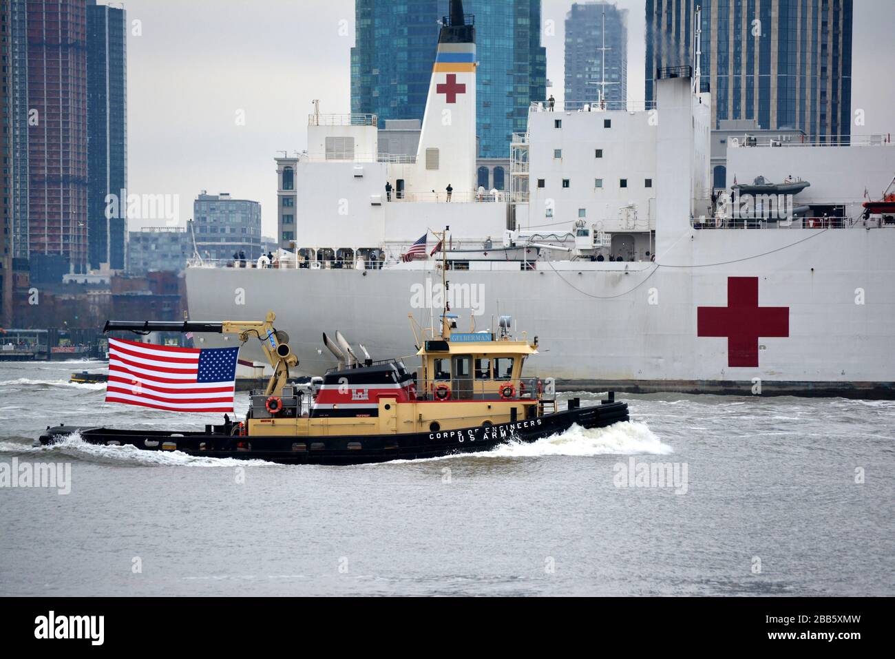 The USNS Comfort arrives in Manhattan to help hospitals handle patients during the coronavirus outbreak in the United States. Stock Photo