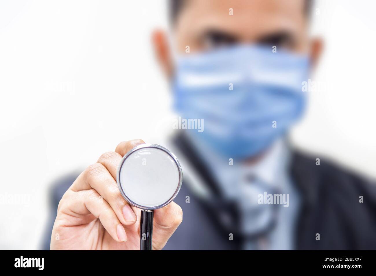 Portrait of young doctor holding stethoscope Stock Photo - Alamy