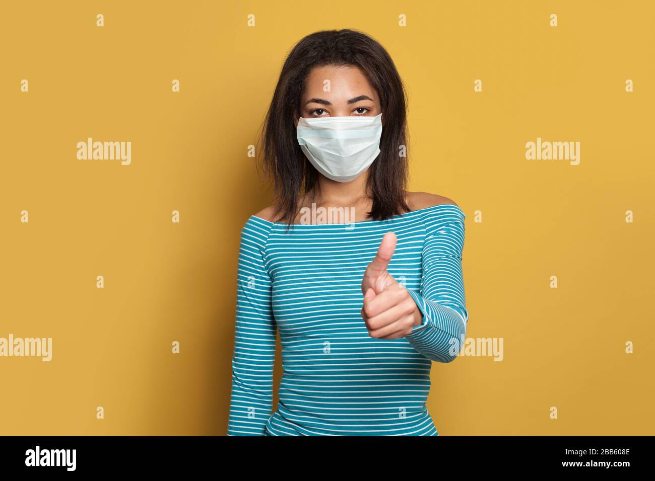 Download Black African American Woman In Face Mask Showing Thumb Up On Yellow Background Stock Photo Alamy PSD Mockup Templates