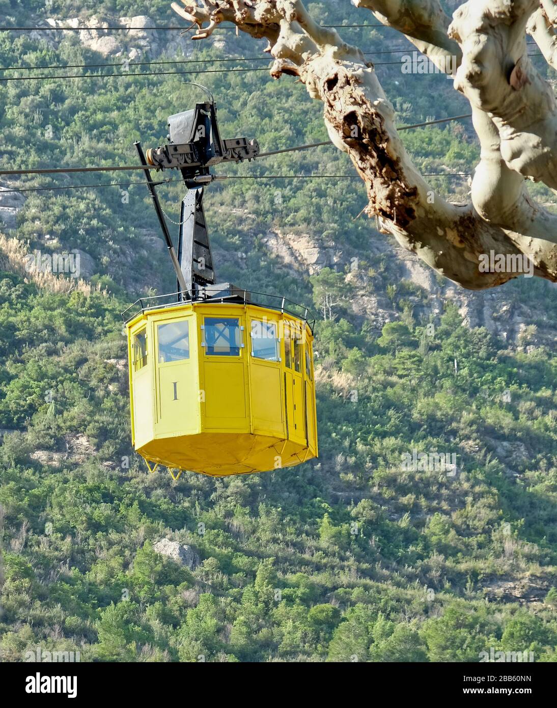 Yellow cable car in the Spanish mountains Stock Photo