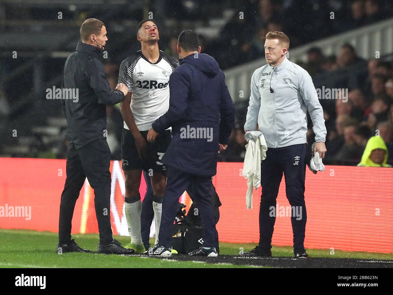Derby County's Curtis Davies changes his shirt after receiving a kick from Wigan Athletic's Kieffer Moore (not pictured) Stock Photo