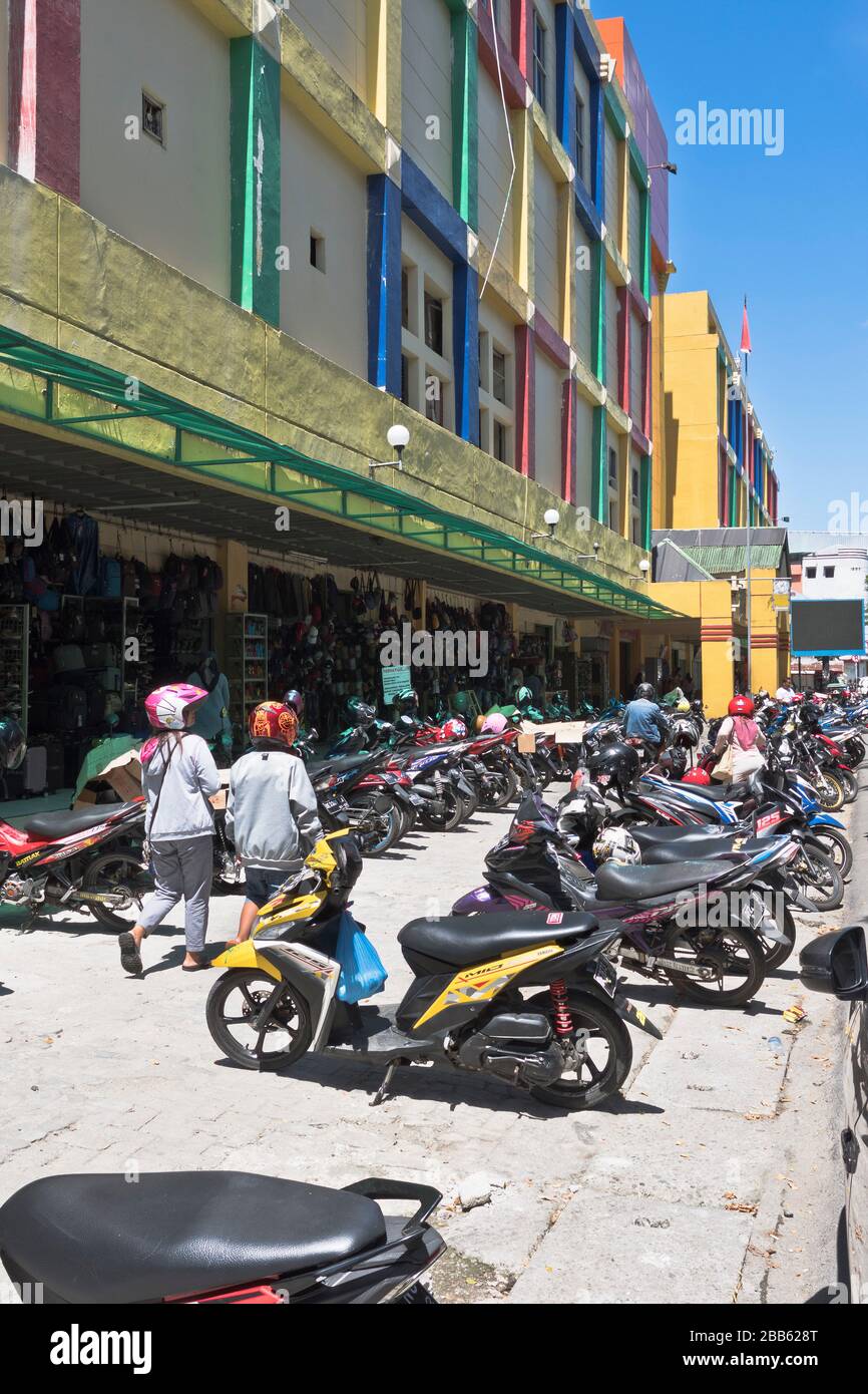 dh Asia AMBON MALUKU INDONESIA Row of parked motor bikes outside shops cityscooters motorbikes motorcycles Stock Photo