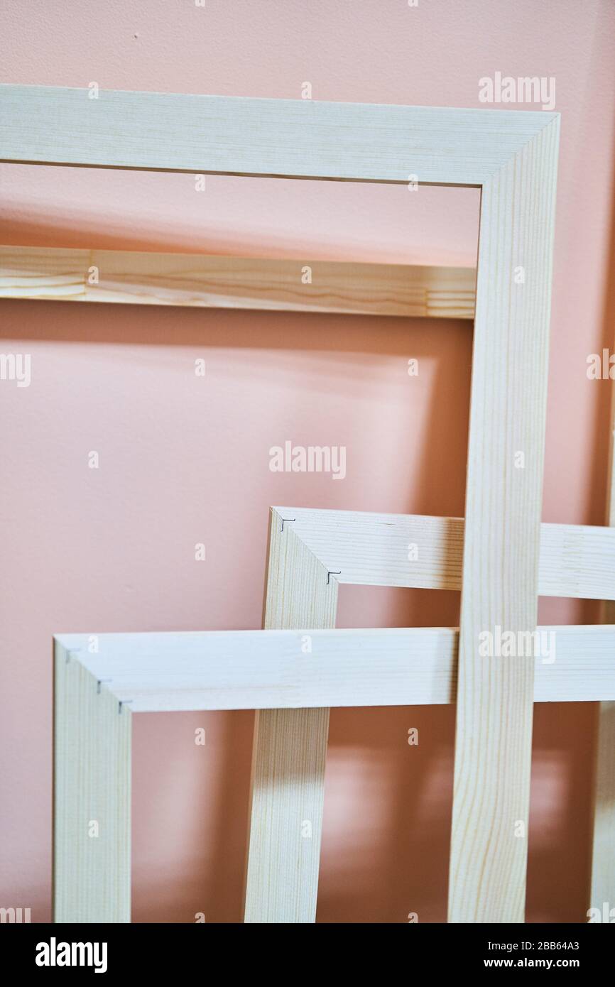 Wooden frames on a pink background. Frames for photos and paintings Stock Photo