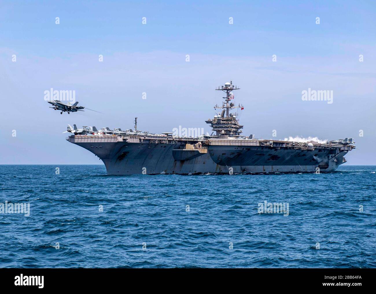 A U.S. Navy F/A-18F Super Hornet fighter aircraft, attached to the "Fighting Checkmates" of Strike Fighter Squadron 201, prepares to launch off the flight deck of Nimitz-class aircraft carrier USS Harry S. Truman during flight operations March 21, 2020 underway in the Arabian Sea. Stock Photo