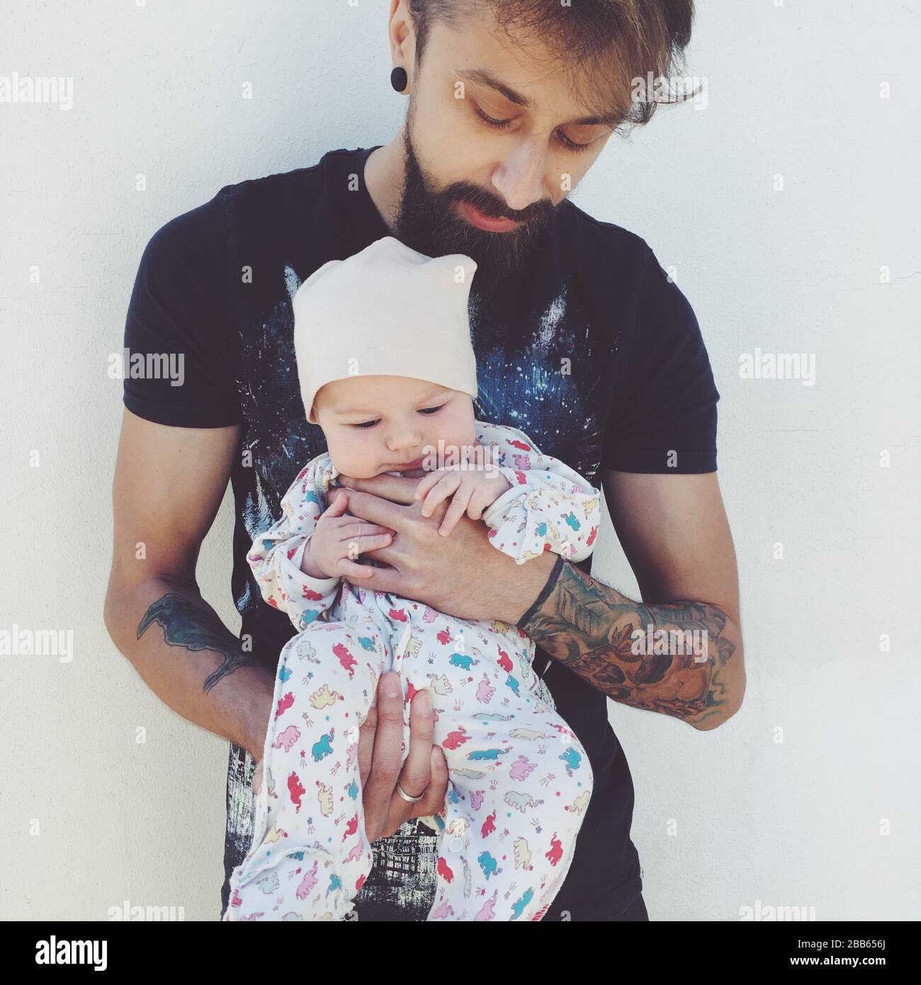 Portrait of a man holding his baby girl Stock Photo