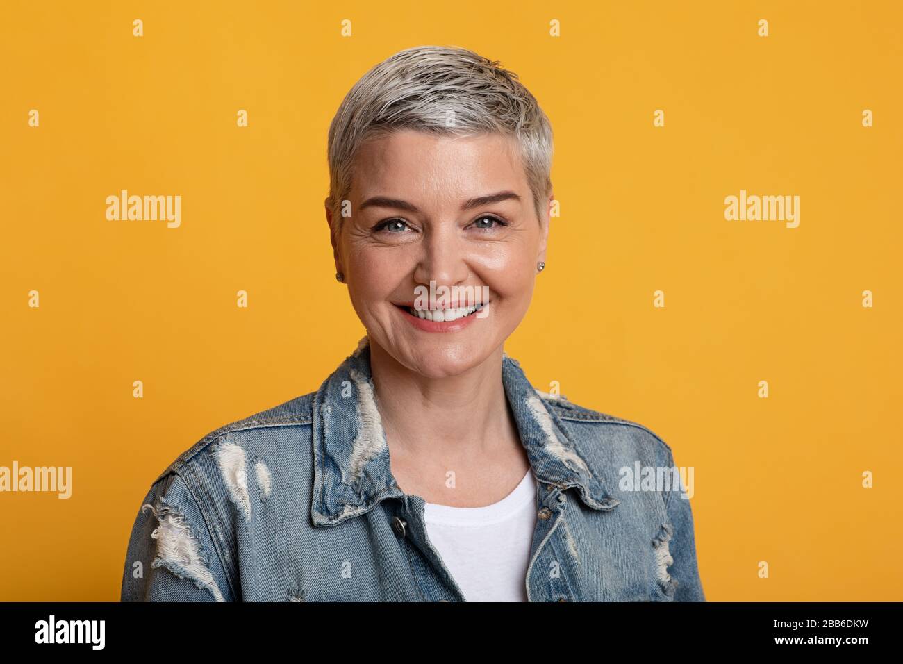 Portrait Of Beautiful Mature Woman With Short Hair Smiling At Camera ...