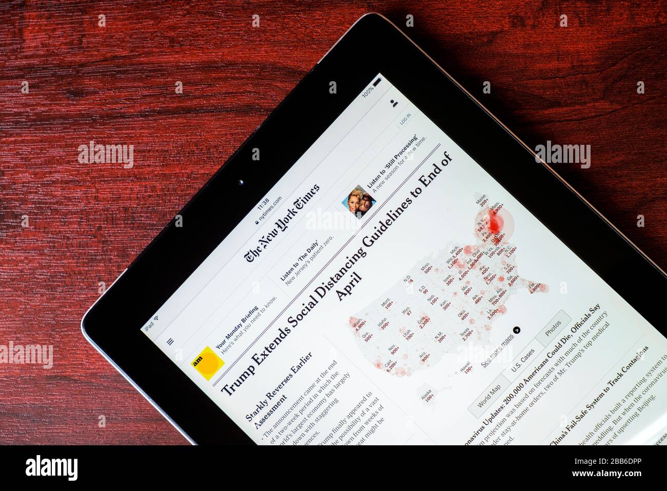 A New York Times article on the New York Times website about the coronavirus COVID 19 outbreak is pictured being viewed on an iPad Stock Photo