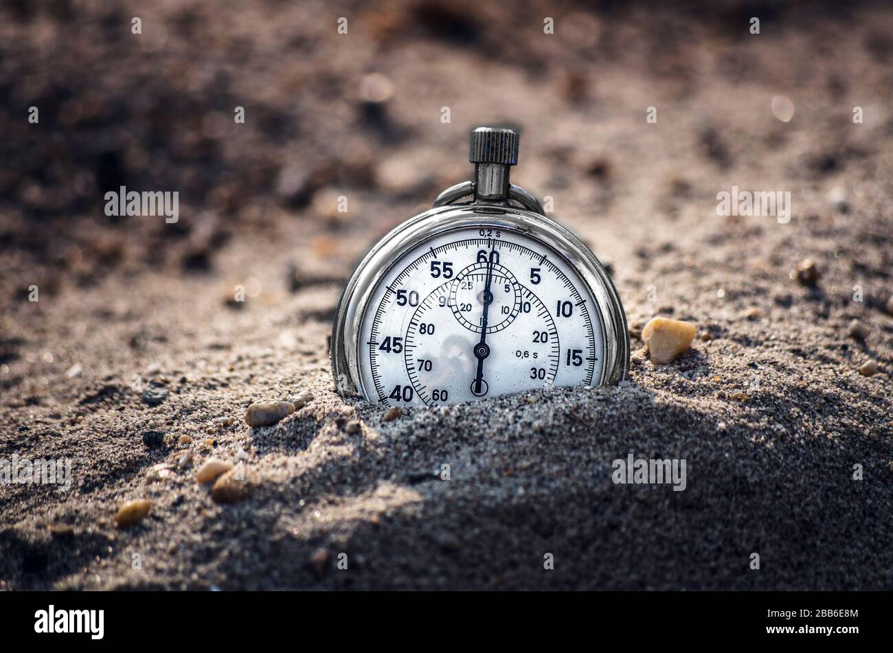 Stopped clock (timer) in sand Stock Photo Alamy