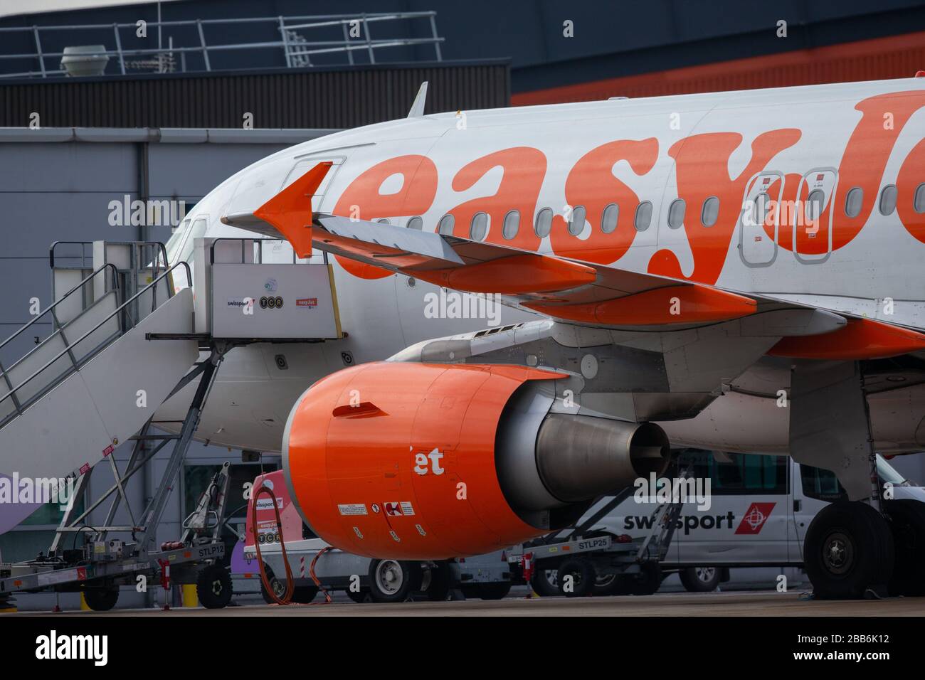 Picture dated March 30th 2020 shows grounded EasyJet planes at Luton Airport on Monday morning after the company grounded the fleet of aircraft due to the Coronavirus outbreak.  Rows of EasyJet planes were seen lined up at Luton Airport today (Mon) after the company grounded its entire fleet of aircraft due to the coronavirus pandemic.  The airline’s 344 planes will now remain grounded and the company has worked with union Unite to agree two-month furlough arrangements for cabin crew, which means they will be paid 80 per cent of their pay. Stock Photo
