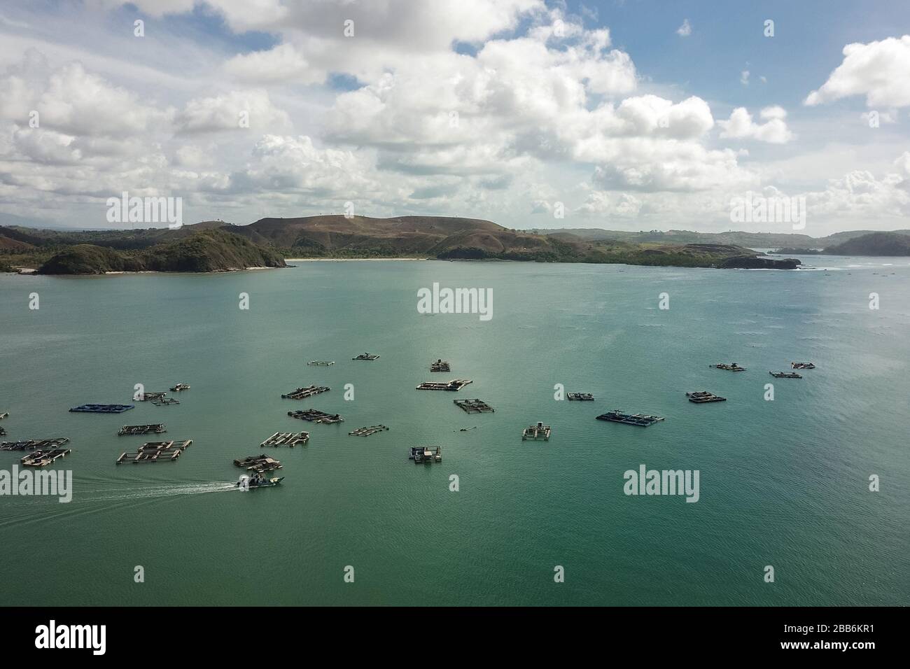 Aerial view of traditional floating fishing cages, Gerupuk Bay, Lombok, Indonesia Stock Photo
