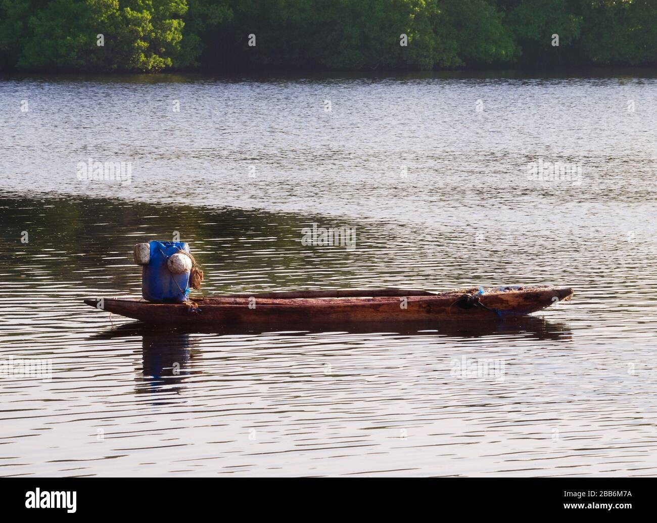 Lonesome wooden boat for fishing in sea bay in Ceylon Stock Photo