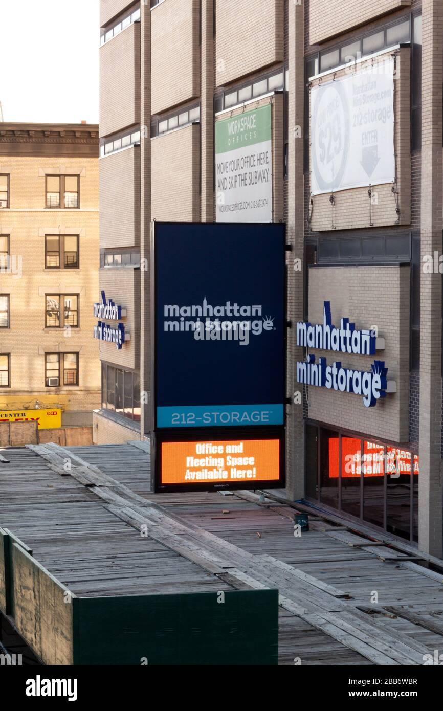 sign shot from above of a Manhattan Mini Storage location. Many New Yorkers keep a personal storage unit due to small living spaces in the city Stock Photo