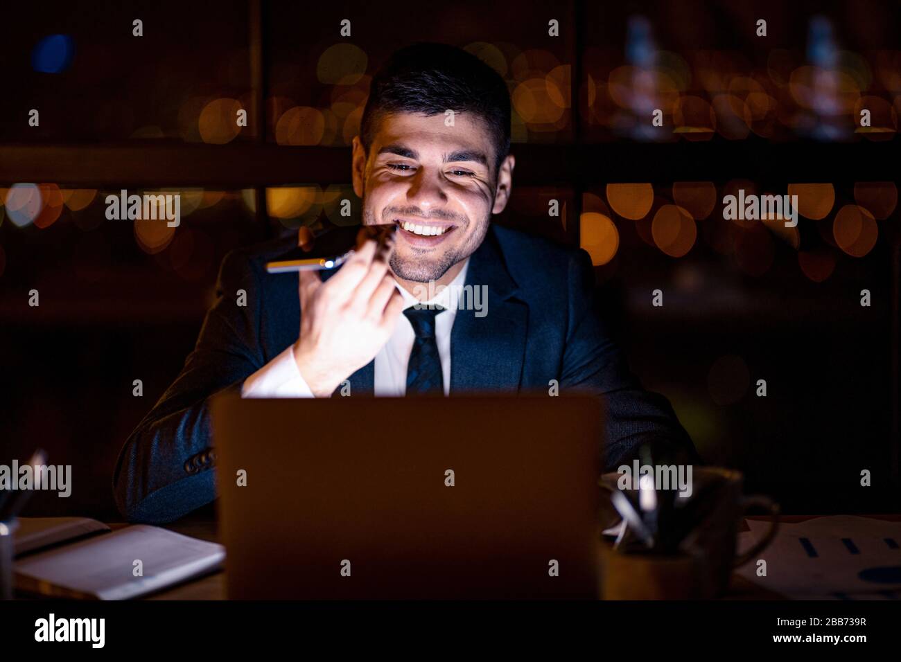 Office Manager Guy Using Voice Assistant On Smartphone In Office Stock Photo
