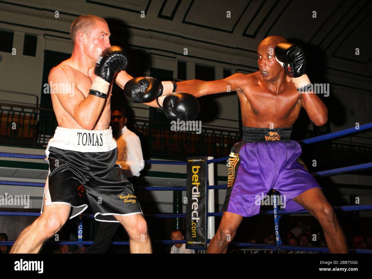 Thomas Grublys (Canning Town, black shorts) defeats Nick Corret (Grimsby, purple shorts) in a Light-Middleweight contest at York Hall, Bethnal Green, Stock Photo