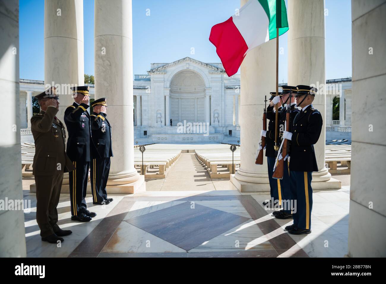 '(From the left) Lt. Gen. Danilo Errico, chief of staff, Italian Army; Maj. Gen. Michael Howard, commanding general, U.S. Army Military District of Washington; and Gen. Mark A. Milley, chief of staff, U.S. Army; renders honors to the Italian flag in the Memorial Amphitheater at Arlington National Cemetery, Arlington, Va., Oct. 17, 2017.  Ericco participated earlier in an Army Full Honors Wreath-Laying Ceremony at the Tomb of the Unknown Soldier and exchanged gifts with Arlington National Cemetery leadership.  (U.S. Army photo by Elizabeth Fraser / Arlington National Cemetery / released); 17 Oc Stock Photo