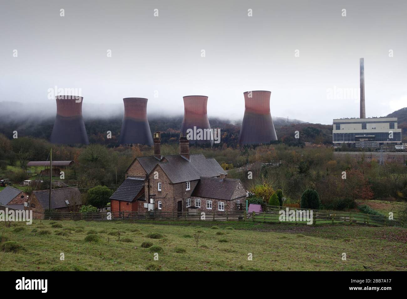Rural cottage overshadowed by Ironbridge Power Station after it was closed down Stock Photo