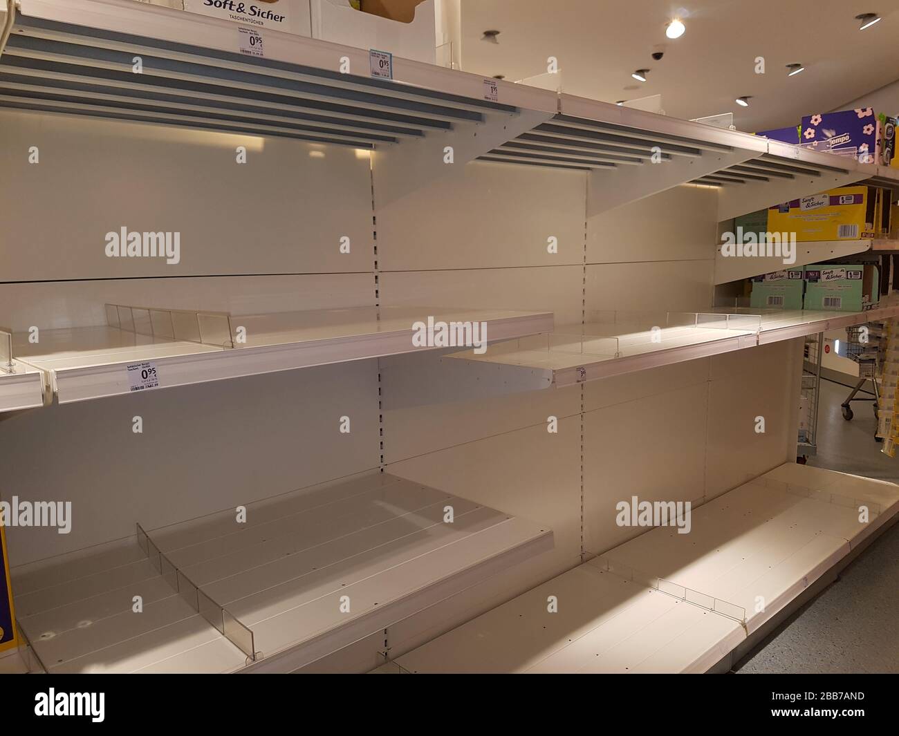 Empty supermarket shelf / shelves - stock sold out - hoarding shopping due to fear of epidemic corona virus / covid-19 called 'Hamsterkauf' in Germany Stock Photo