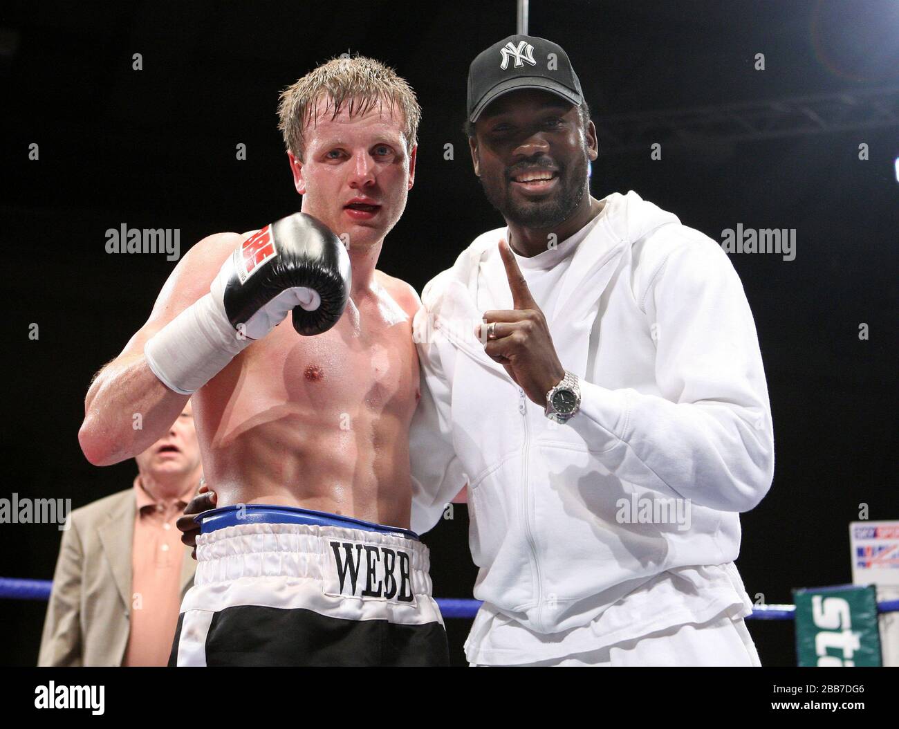 Sam Webb (Isle of Dogs, black shorts) defeats Max Maxwell (Birmingham, white shorts) in a Middleweight boxing contest at Newham Leisure Centre, London Stock Photo